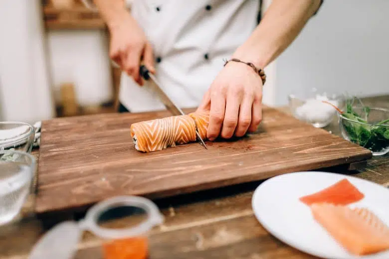 Chef Cutting Sushi Roll