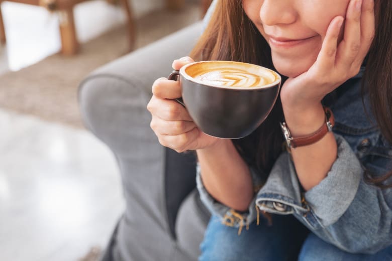Woman Enjoying A Cup Of Coffee